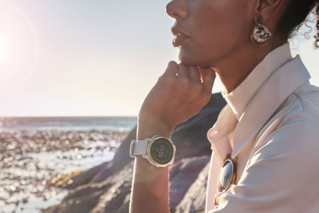 A woman wearing a Garmin smartwatch