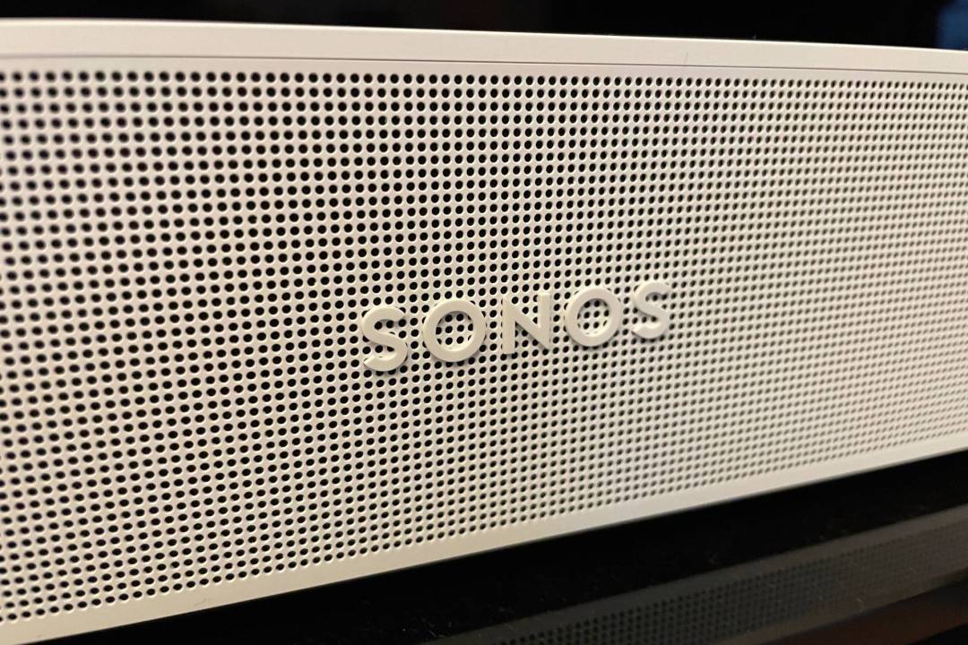 A close-up photo of the Sonos logo on one of its soundbars