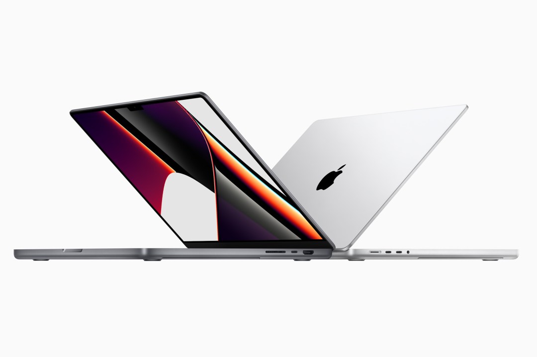 Two Apple MacBooks back-to-back against a white background