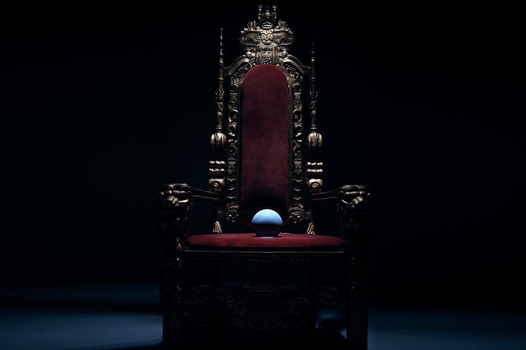 Amazon Echo on UK throne against dark background