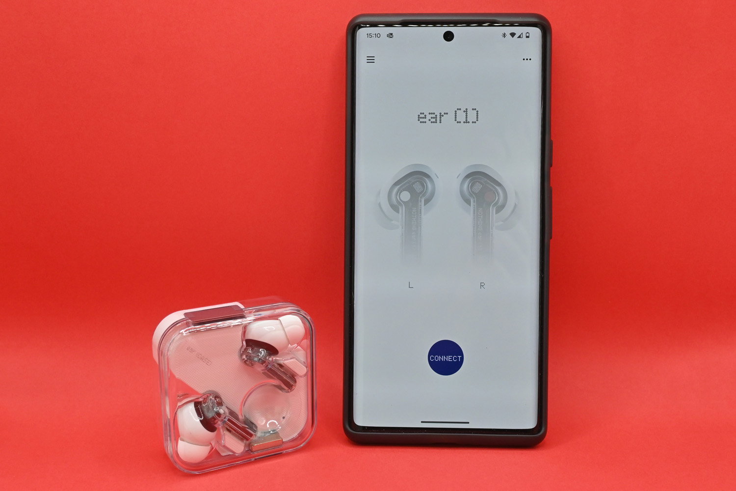 Nothing Ear 1 headphones review case next to phone