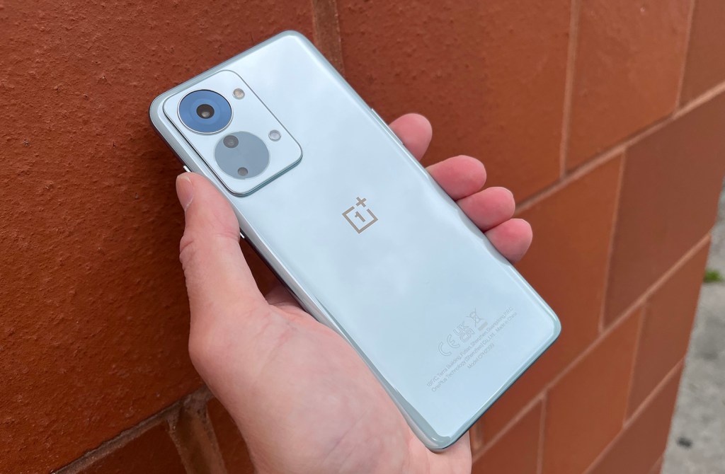OnePlus Nord 2T in rear hand