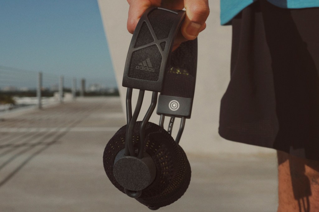 Adidas RPT-02-SOL headphones lifestyle in hand