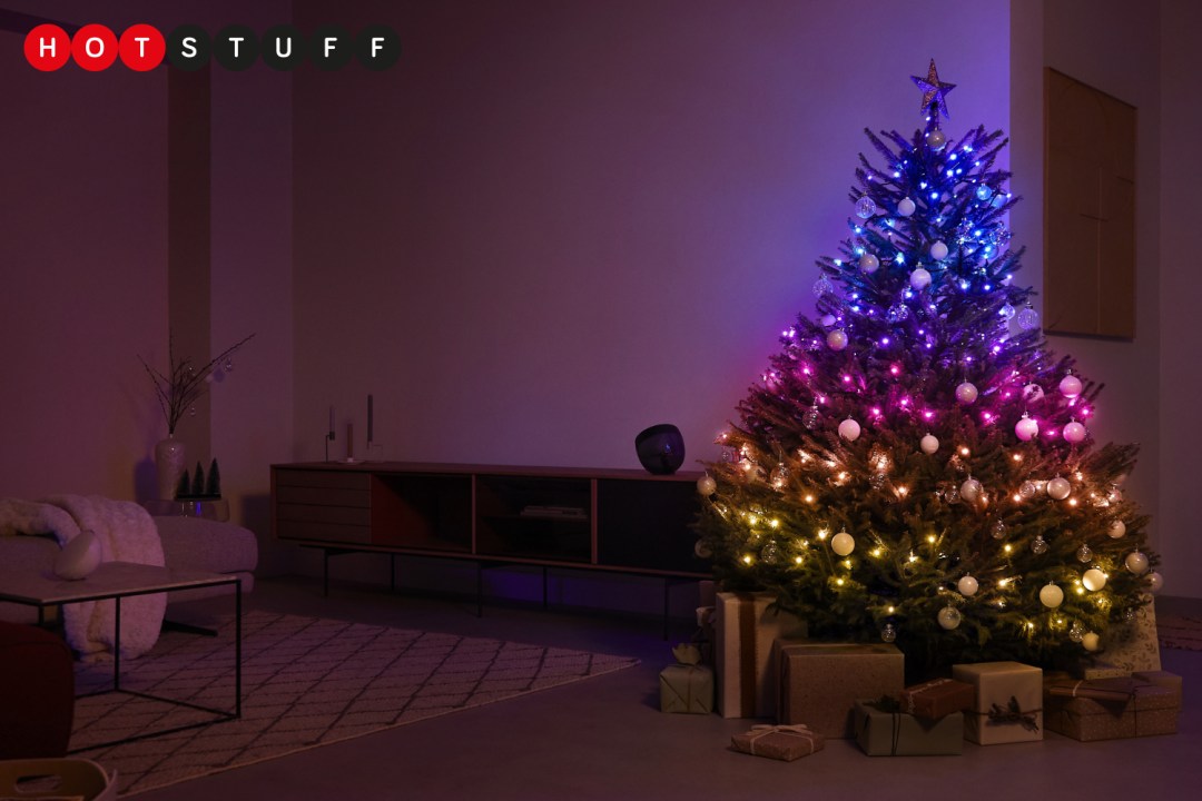 Philips Hue Festavia smart Christmas lights around a Christmas tree in a living room