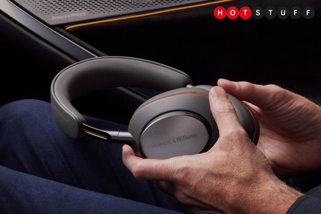 Bowers & Wilkins PX8 McLaren Edition held in hand in a McLaren