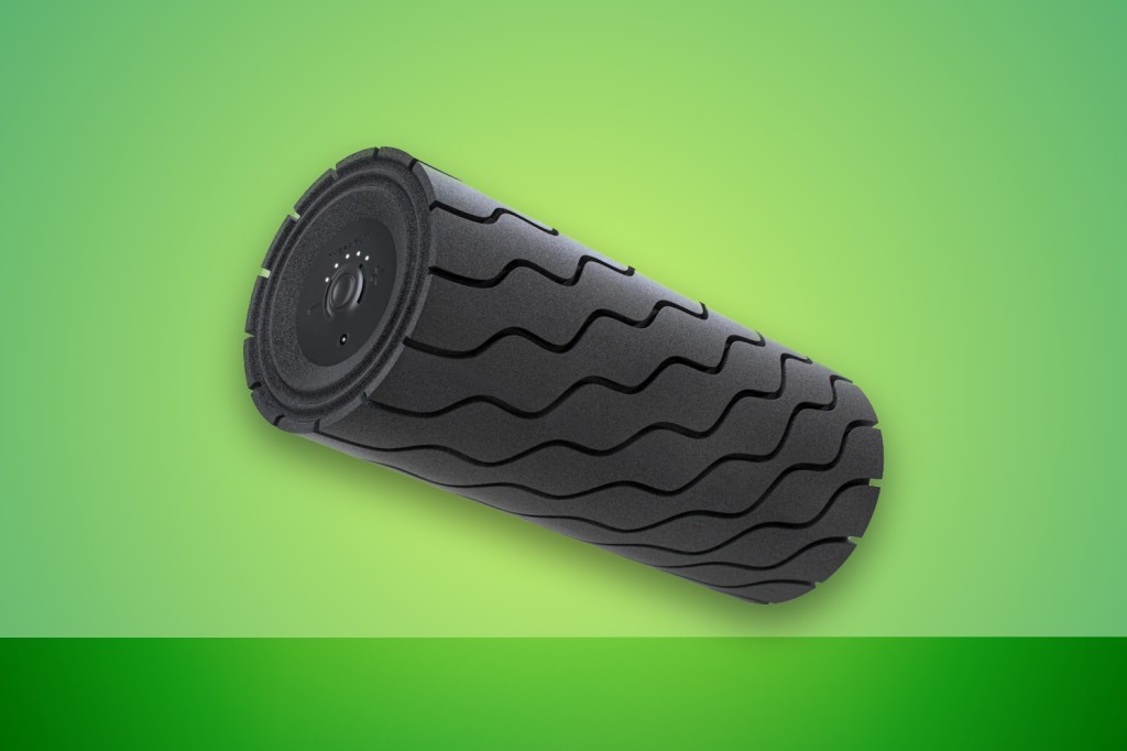 Theragun Wave foam roller against green background