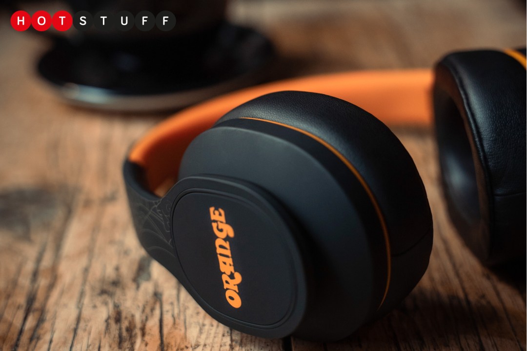 Orange's Crest MK2 headphones on wood table
