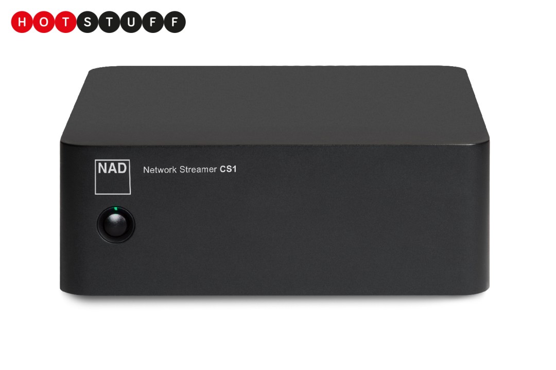 Picture shows a black box on a white background. The box has NAD Network Streamer CS-1 written on it above a black power button and green power light.