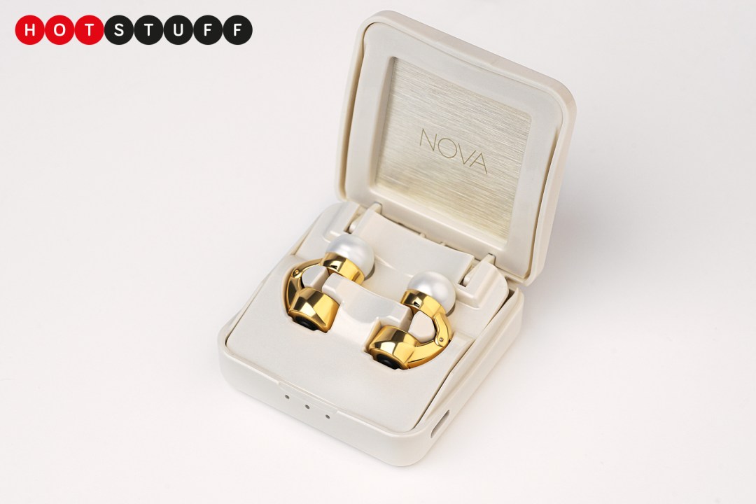 A pair of gold earphones in an open box.