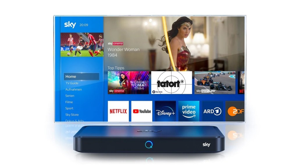 Sky Q box in front of TV running the software