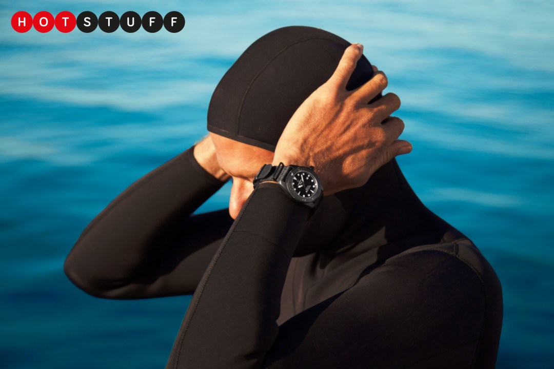 Man in a diver suit wearing the black Certina DS Action Diver Black