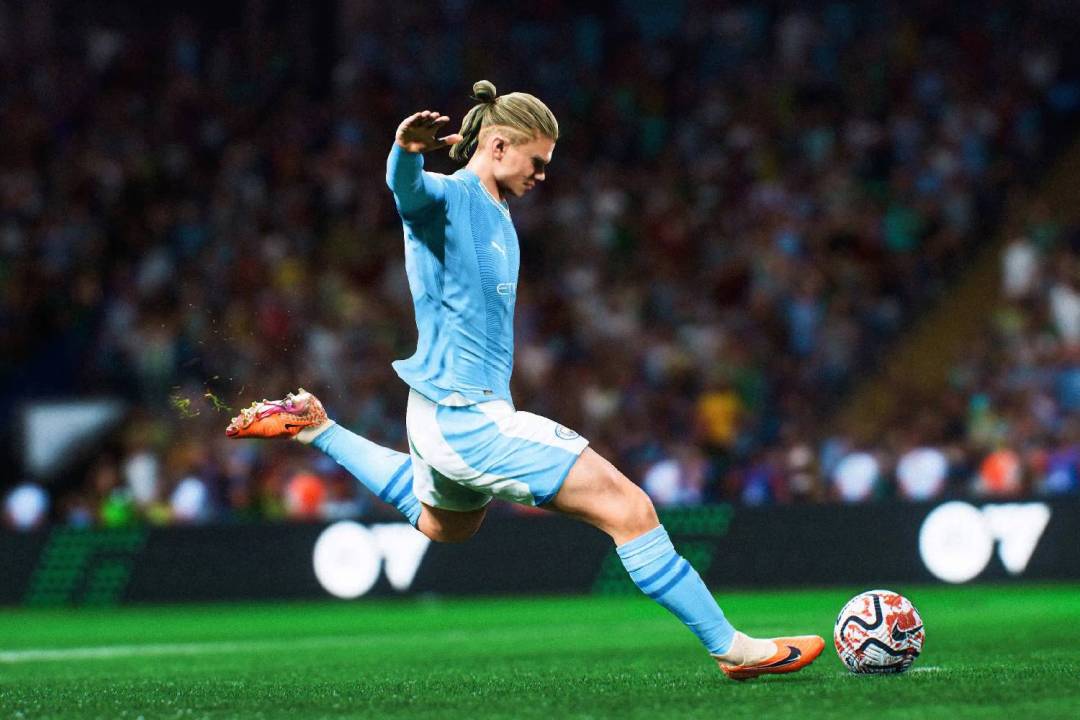 Erling Haaland wearing a Manchester City kit kicks a football in EA Sports FC 24