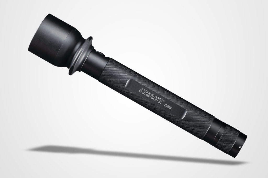 Best torches round-up: Coast TX22R flashlight pictured on a grey background with a drop shadow.