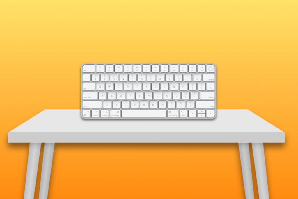 Apple Magic Keyboard with Touch ID on a white desk