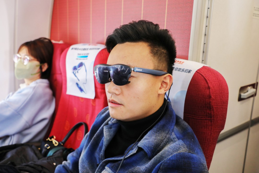 Rokid AR Glasses being worn on Hainan flight