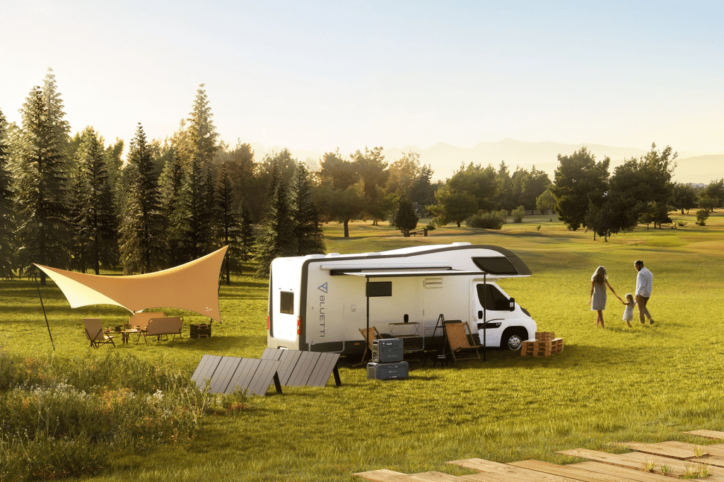 A campervan in the fields with solar panels