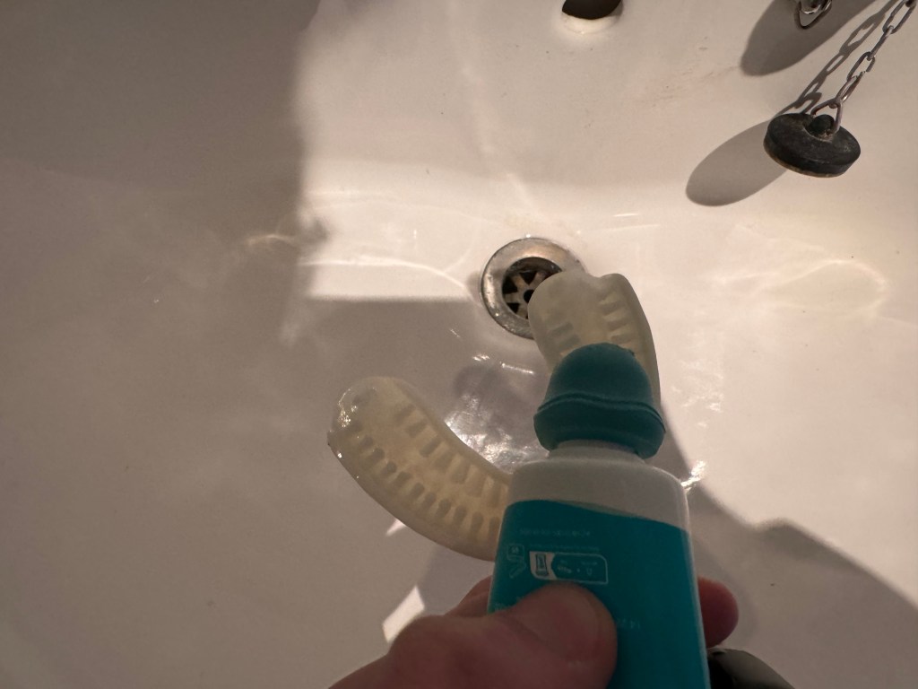 Applying toothpaste to the Y-Brush