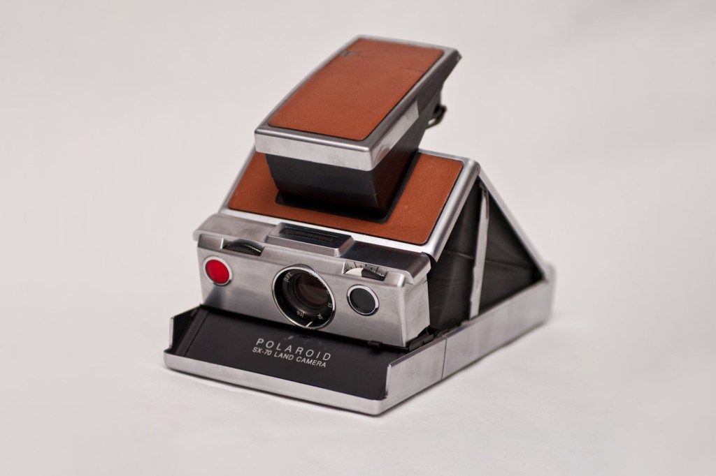 Polaroid SX-70 
By Thomas Backa from Turku, Finland - Polaroid SX-70, CC0, https://commons.wikimedia.org/w/index.php?curid=45838053