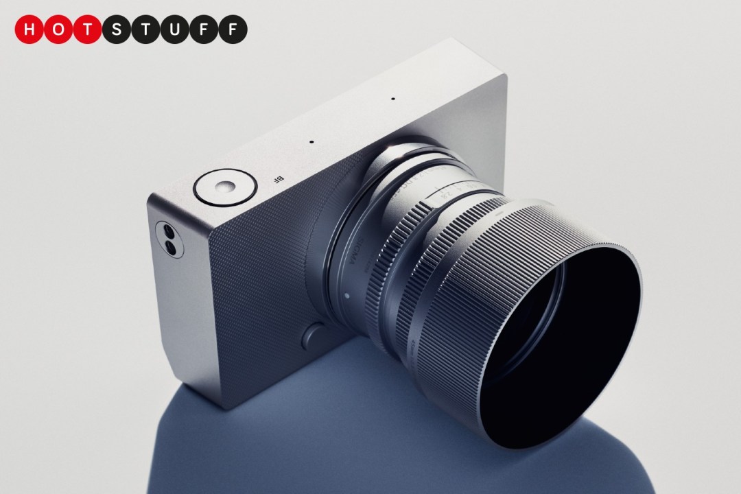 A silver Sigma BF camera with lens attached on a pale background