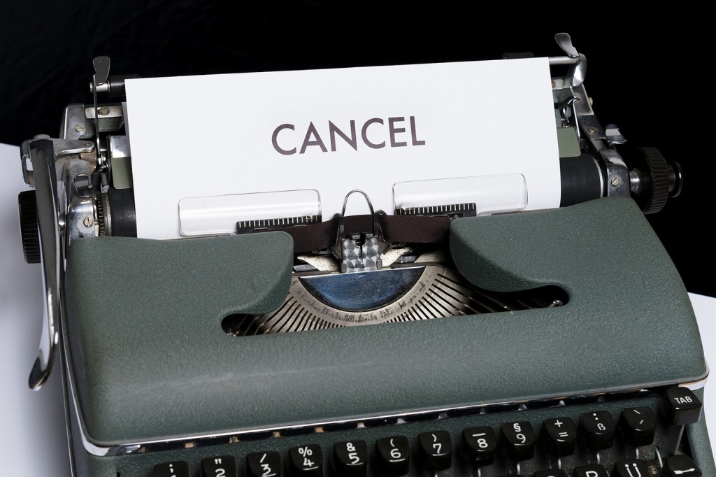 Typewriter with cancel written on the paper