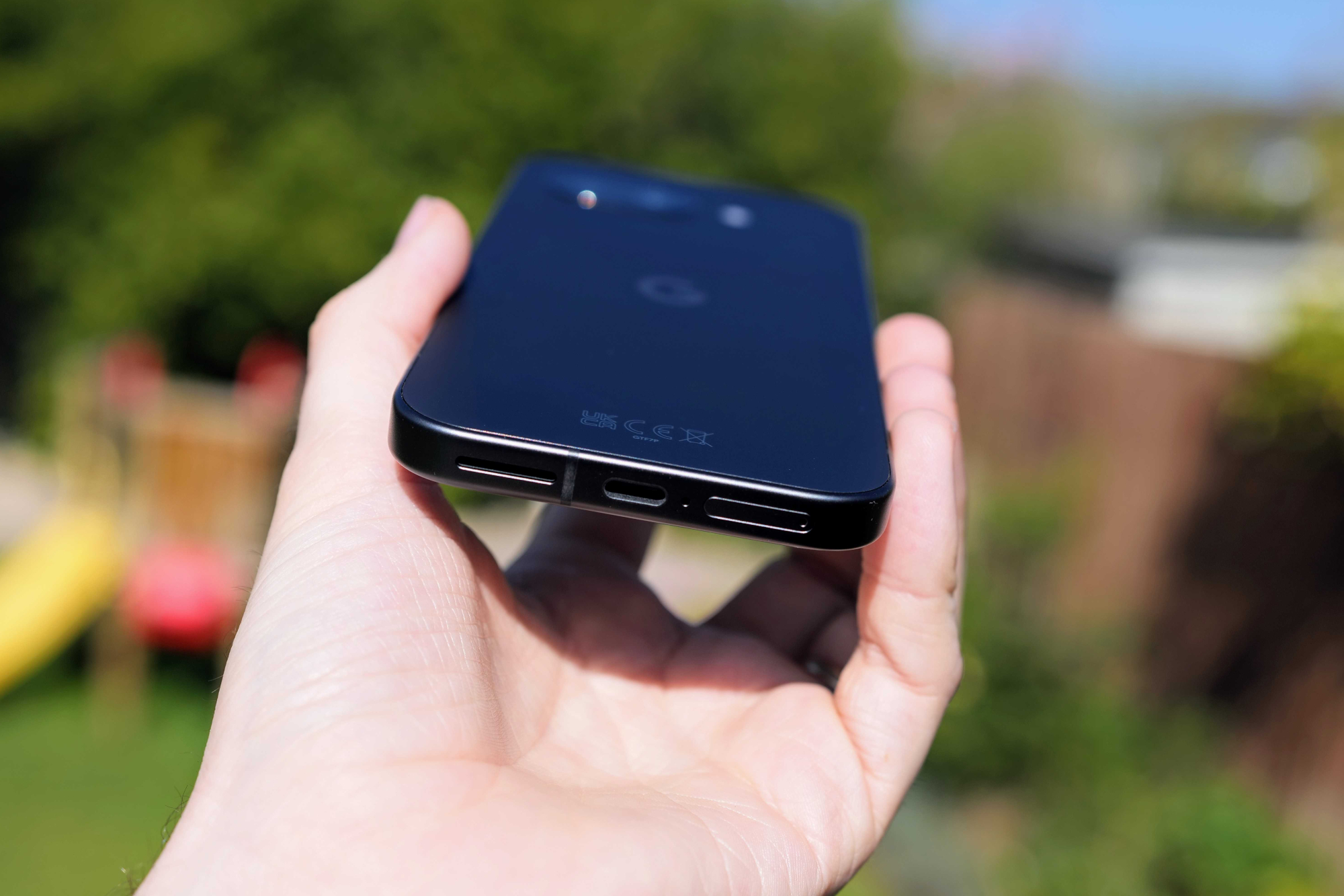 Google Pixel 9a in hand