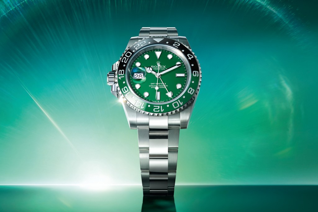 Rolex GMT Master II White Gold on green background