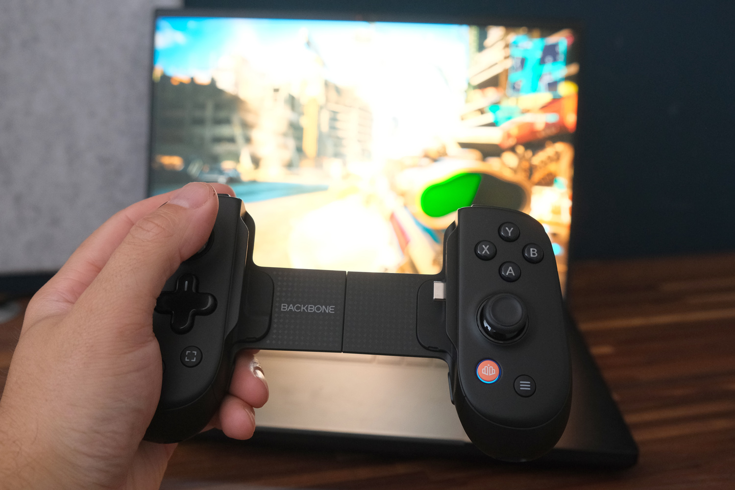 Backbone Pro controller review in hand laptop