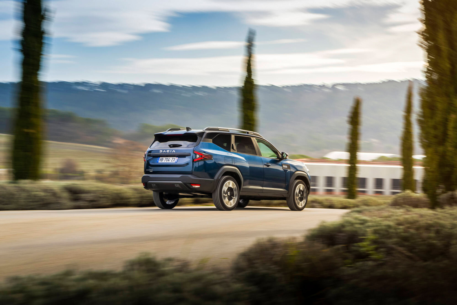 Dacia Bigster Hybrid 155 drive on the road rear
