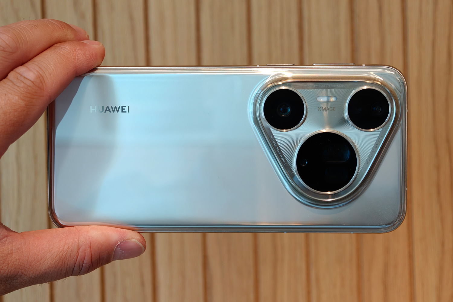 Huawei Pura 80 Ultra review in hand rear landscape