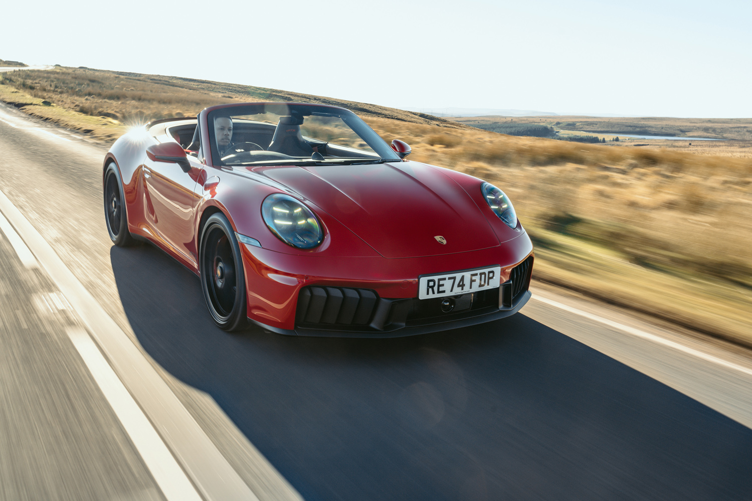 Porsche 911 GTS Cabriolet drive on road front