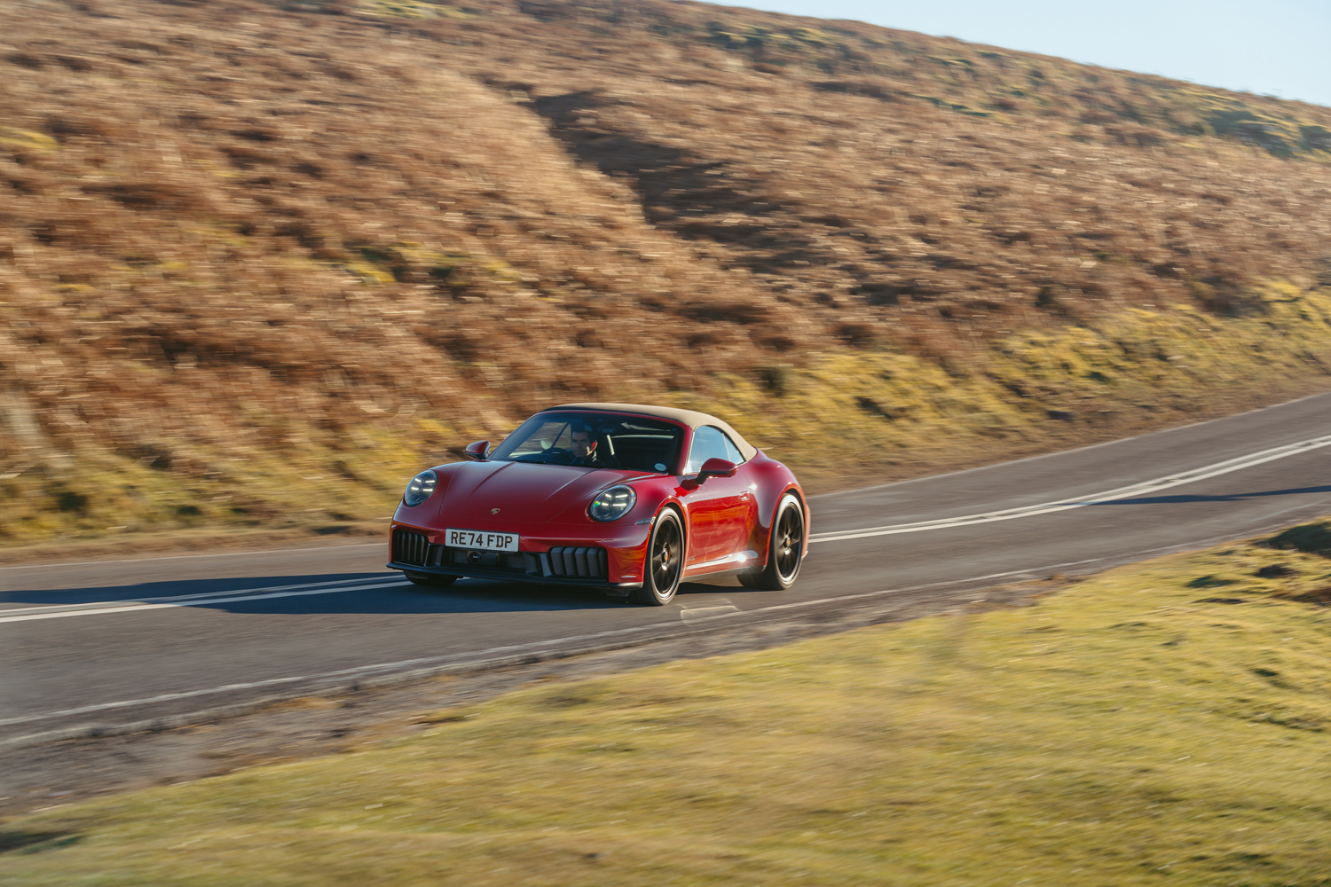 Porsche 911 GTS Cabriolet driving roof up front