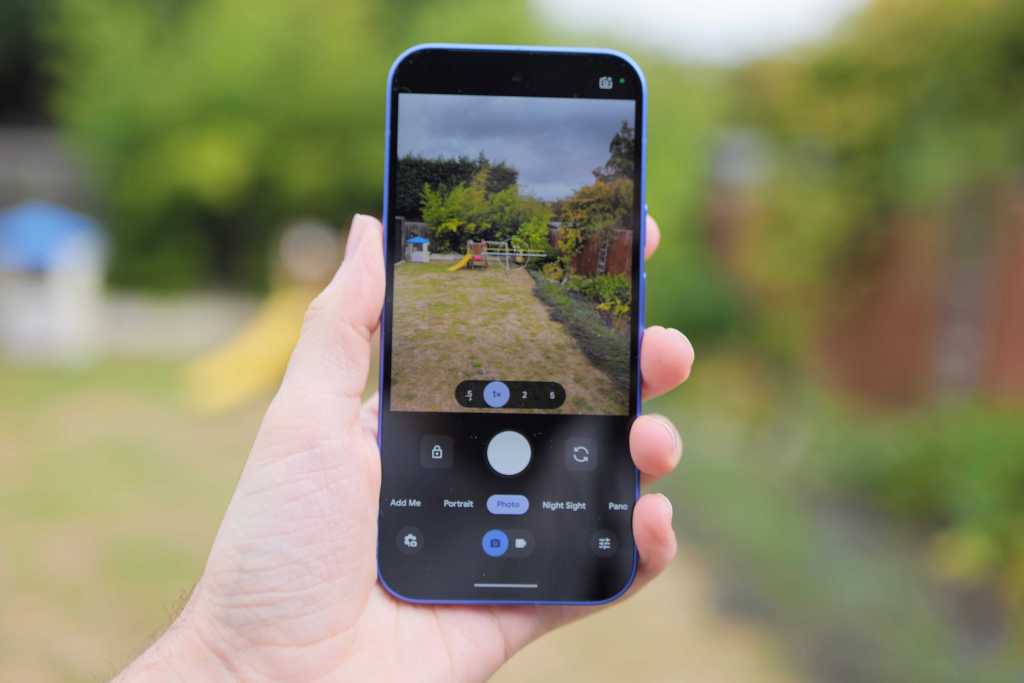 Google Pixel 10 in hand, camera app