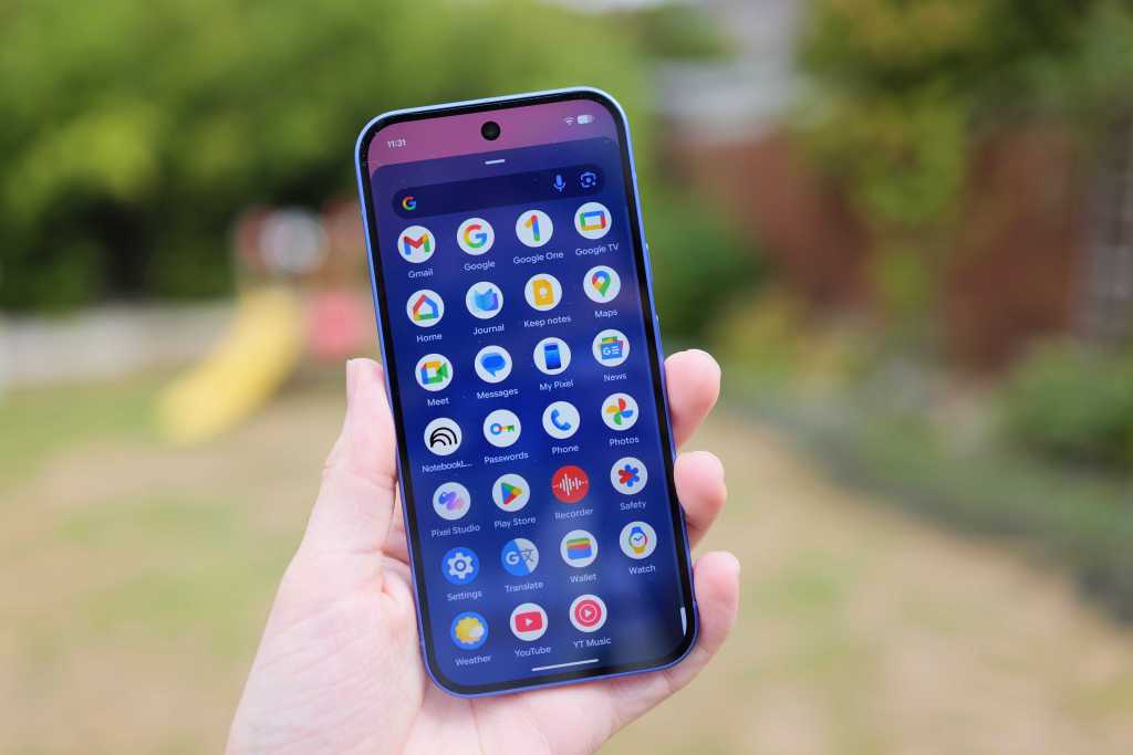 Google Pixel 10 in hand, app drawer