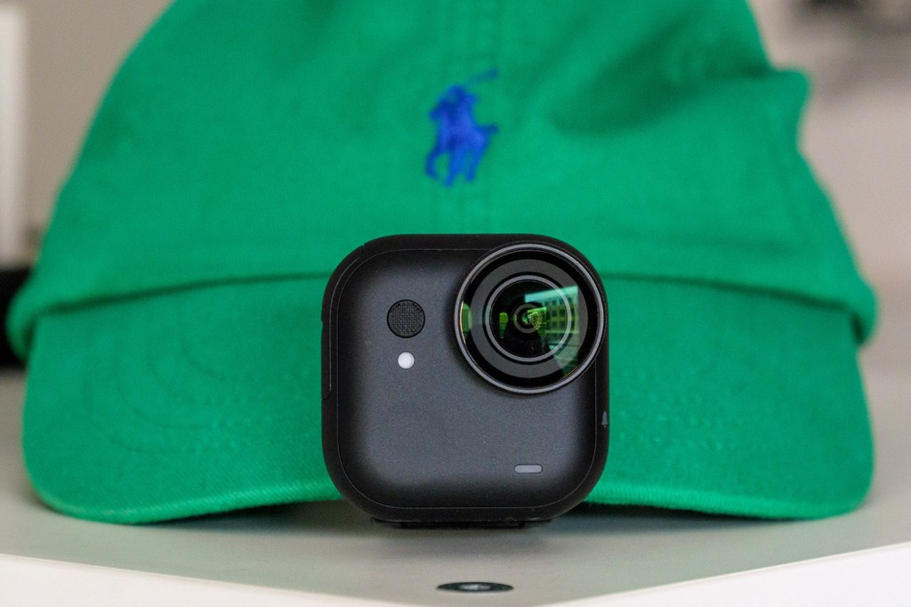 Insta360 Go Ultra clipped to baseball cap