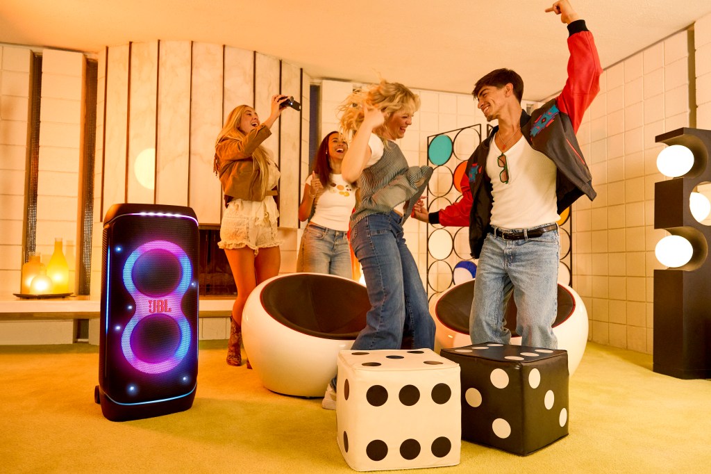 JBL PartyBox 720 speaker in a party with people dancing around it