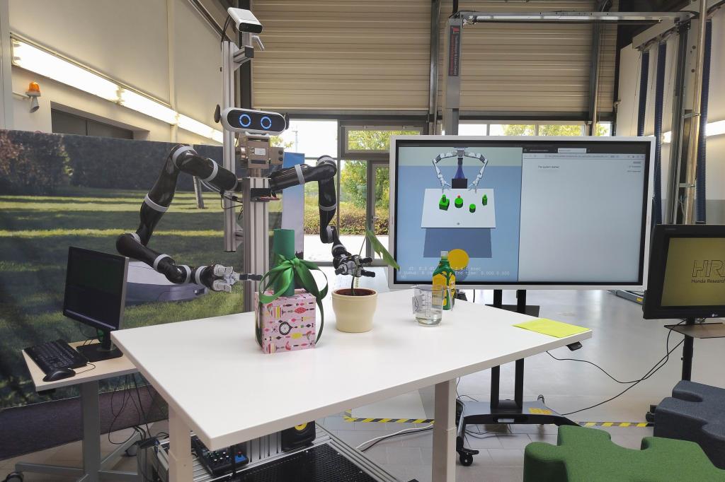A Honda humanoid robot with objects on a table