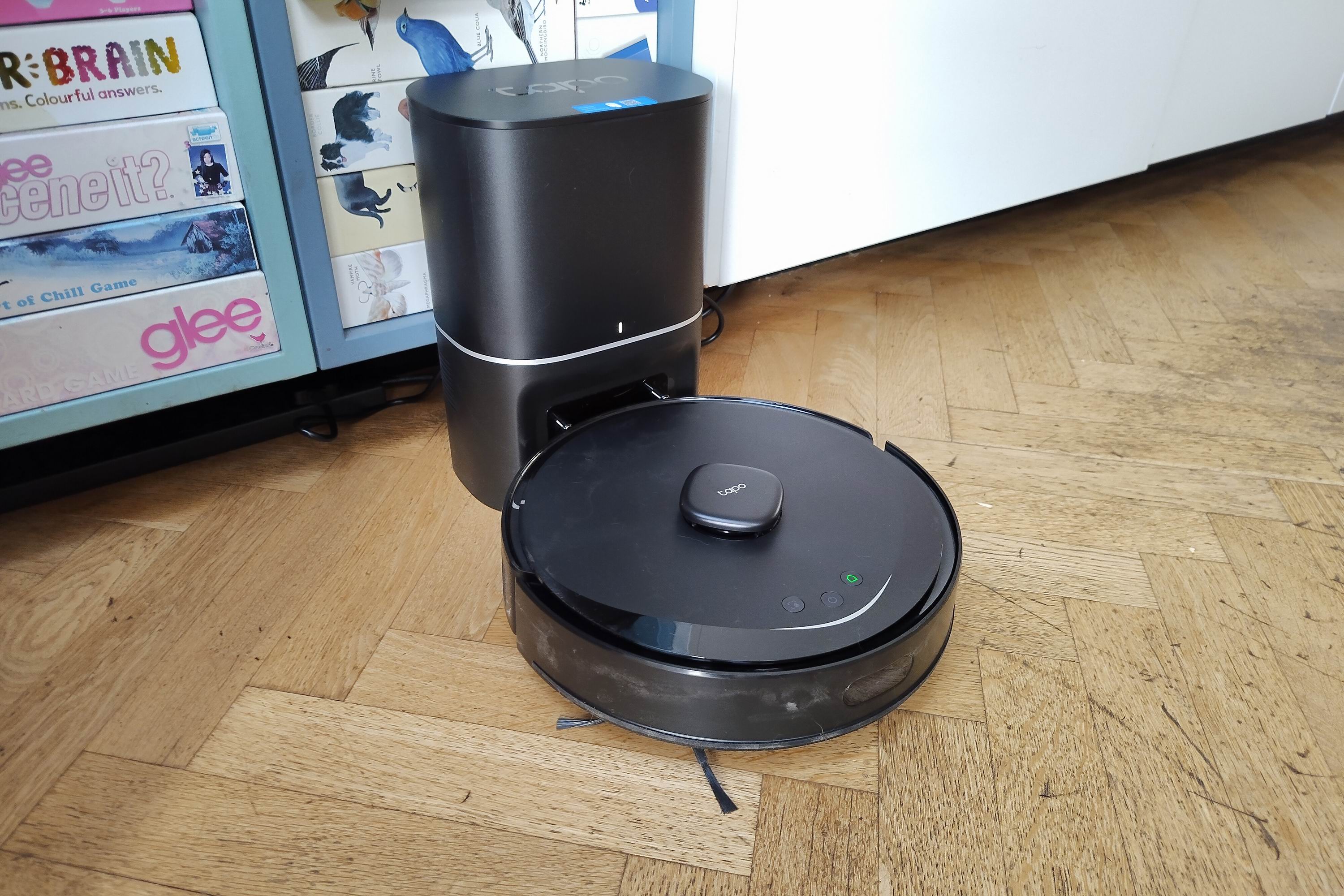 A robot vacuum on its charging station