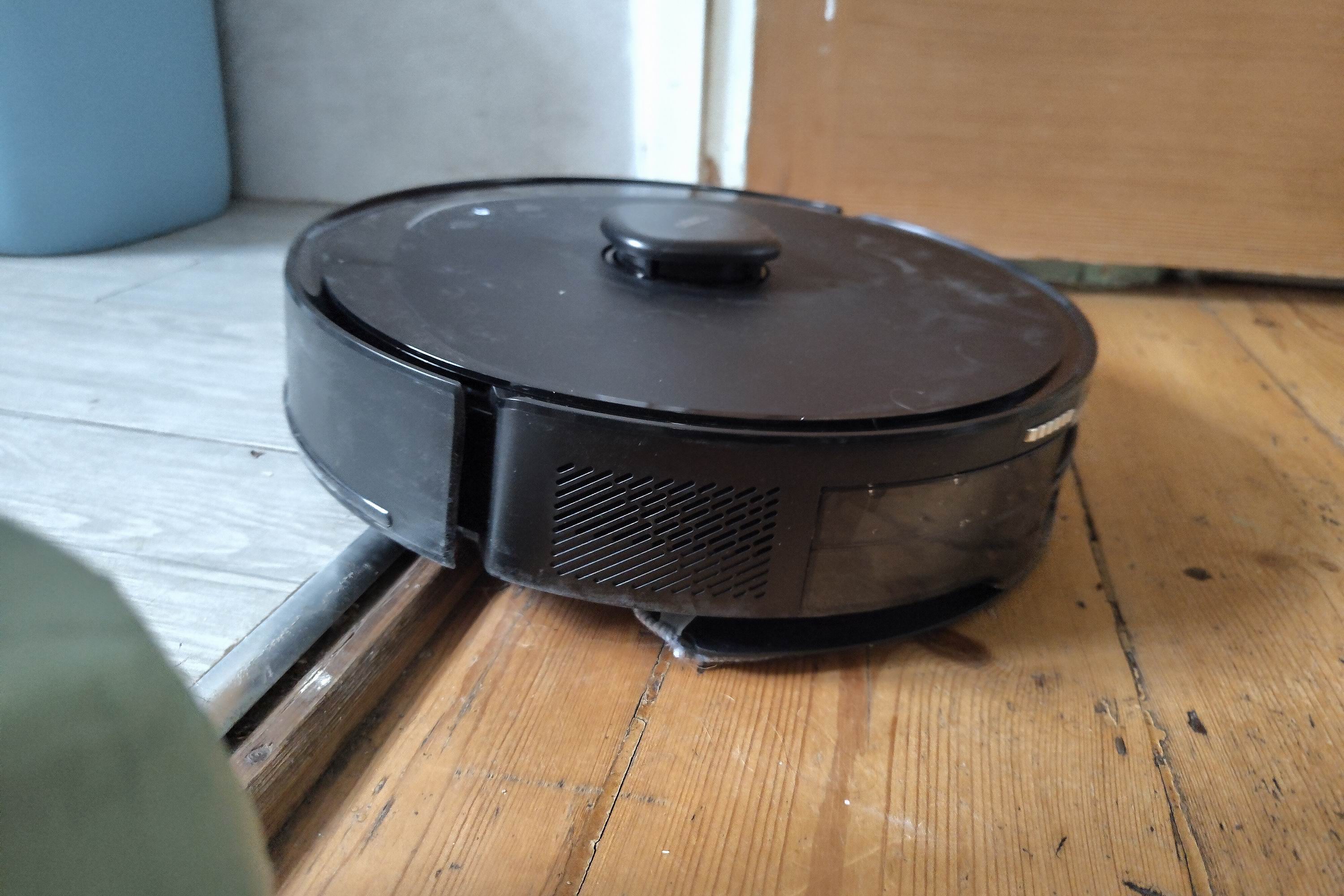 A robot vacuum tried to get over the step up into a bathroom