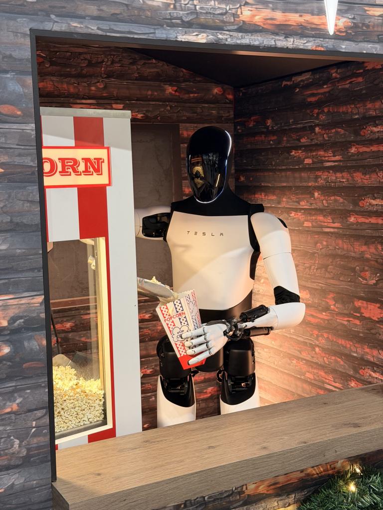 Tesla's Optimus pouring popcorn