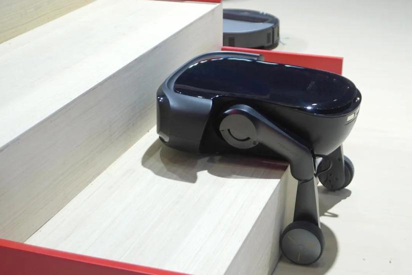 I’ve tried a robot vacuum with an arm, now here’s one with legs