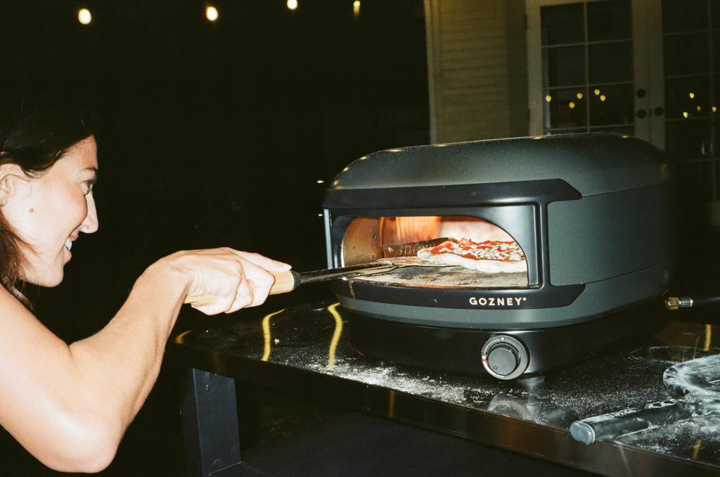 Person using a Gozney Arc Lite